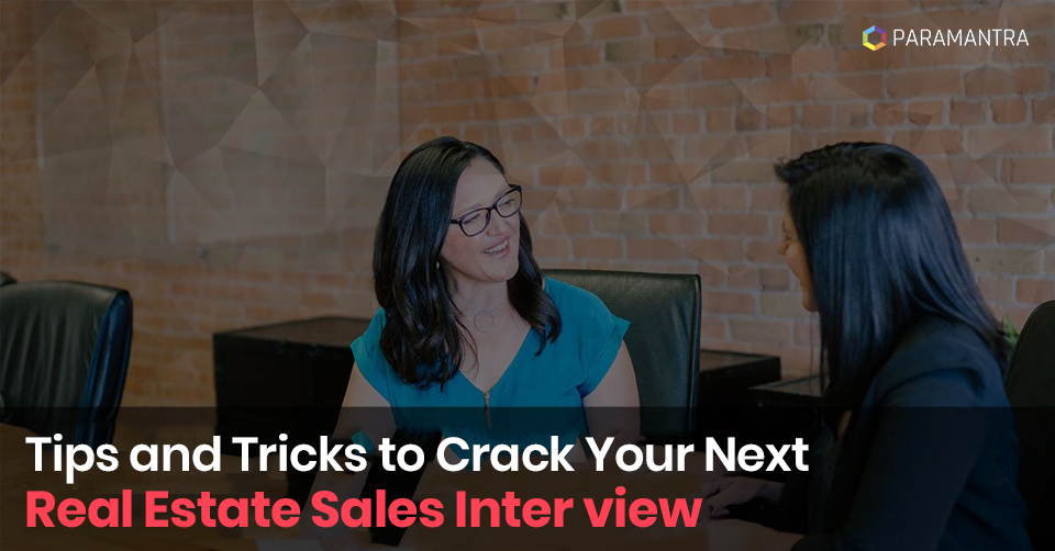 Confident candidate answering Real Estate Sales interview questions in an office setting